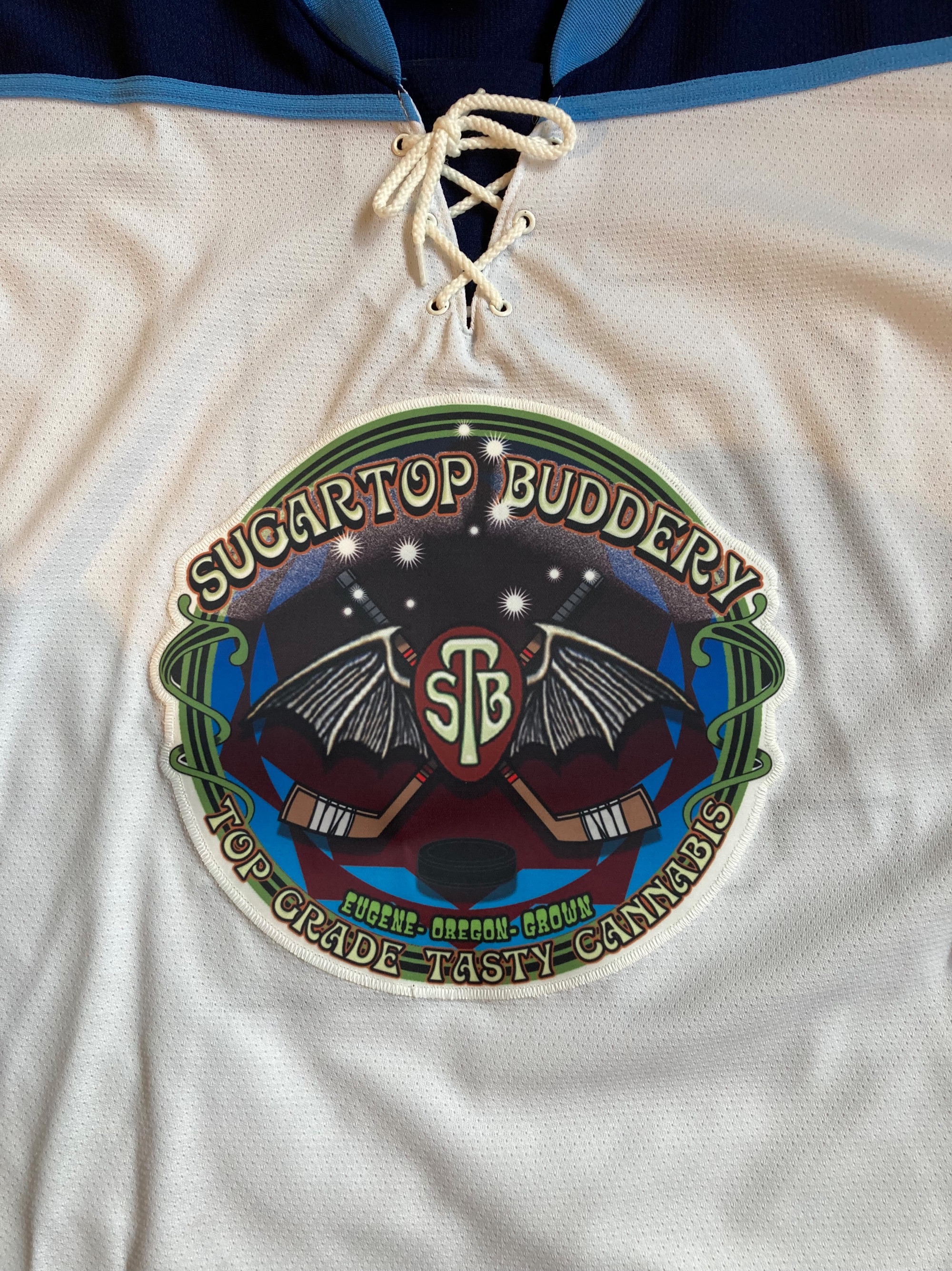 Bat Logo on light jersey